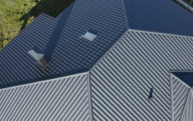 Standing-seam metal roof, shown when Fayetteville weather is clear.